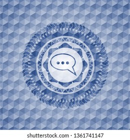 speech bubble icon inside blue emblem or badge with abstract geometric pattern background.