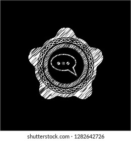 speech bubble icon inside chalkboard emblem