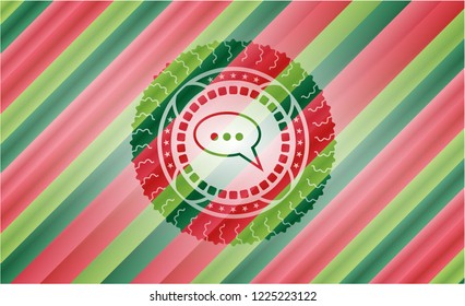 speech bubble icon inside christmas style emblem.