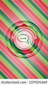 speech bubble icon inside christmas colors emblem.