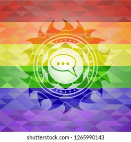 speech bubble icon inside emblem on mosaic background with the colors of the LGBT flag