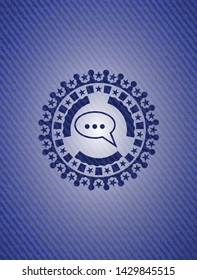 speech bubble icon inside emblem with jean background