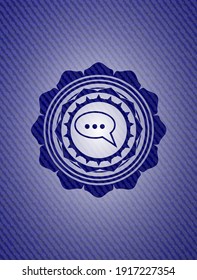 speech bubble icon inside emblem with denim high quality background. 