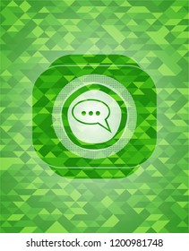 speech bubble icon inside green mosaic emblem