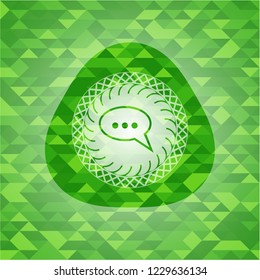 speech bubble icon inside green emblem. Mosaic background