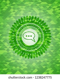 speech bubble icon inside green emblem. Mosaic background