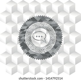 speech bubble icon inside grey icon or emblem with geometric cube white background