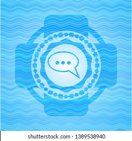speech bubble icon inside light blue water wave emblem background.