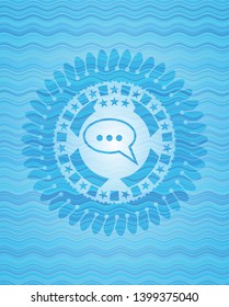 speech bubble icon inside light blue water wave badge background.
