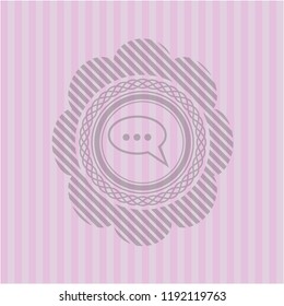speech bubble icon inside pink emblem