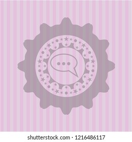speech bubble icon inside pink emblem
