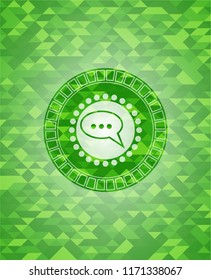speech bubble icon inside realistic green mosaic emblem