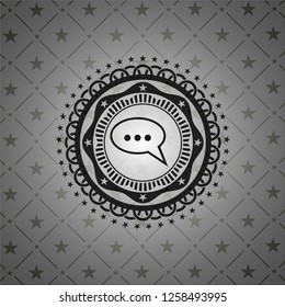 speech bubble icon inside realistic dark emblem