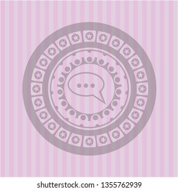 speech bubble icon inside retro style pink emblem