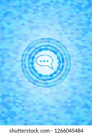 speech bubble icon inside sky blue mosaic emblem