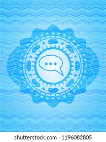 speech bubble icon inside water style emblem.