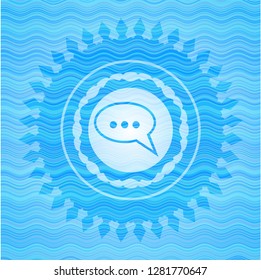 speech bubble icon inside water concept badge.