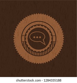 speech bubble icon inside wood emblem. Vintage.