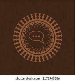 speech bubble icon inside wooden emblem. Retro