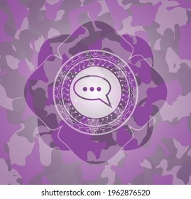 speech bubble icon on pink and purple camo texture. 