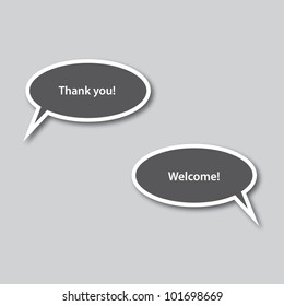 Speech Bubble Pair – Thank You and Welcome Text in Dark Gray Dialog Icons on Light Background. A pair of speech bubbles displayed on a light gray background. The left bubble contains the phrase “Thank you!” and the right bubble says “Welcome!” Both bubbles are dark gray with white borders and white text, arranged side by side to represent a polite conversational exchange. This clean and expressive design is ideal for use in communication-themed graphics, customer service visuals, educational materials, and editorial layouts. Suitable for both commercial and editorial use across print and digital platforms.