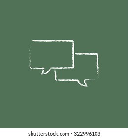 Speech square hand drawn in chalk on a blackboard vector white icon isolated on a green background.