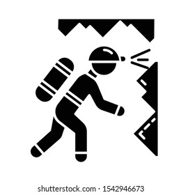 Spelunking glyph icon. Caving, potholing. Exploring underground caverns. Equipped spelunker, caver. Walking, climbing in caves. Silhouette symbol. Negative space. Vector isolated illustration