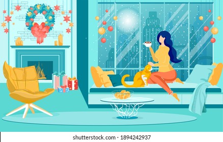 Spending Cold Winter Evening at Home. Young Woman Sitting by Huge Window with Big City Outside with Hot Drink, Petting Her Cat, Watching Falling Snow. Cozy Living Room with Christmas Decorations.