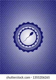 sperm icon inside badge with denim texture