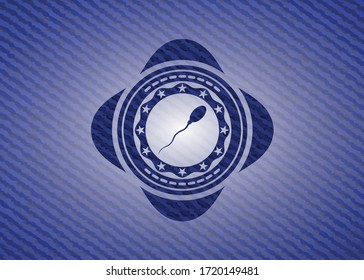 icono de esperma dentro de la placa con fondo de denim. 