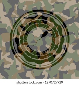 sperm icon inside camouflaged emblem