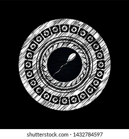 sperm icon inside chalk emblem written on a blackboard