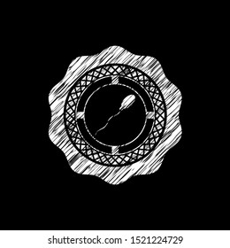 sperm icon inside chalkboard emblem on black board