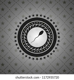 sperm icon inside dark emblem