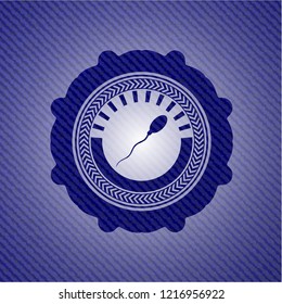 sperm icon inside emblem with denim texture