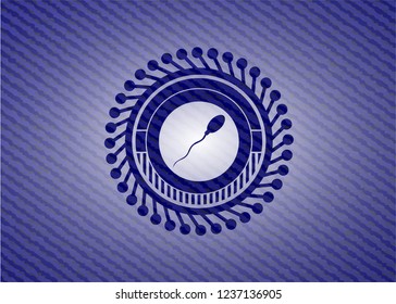 sperm icon inside emblem with denim high quality background