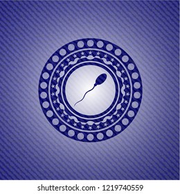 sperm icon inside emblem with jean texture