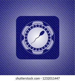 sperm icon inside emblem with jean background