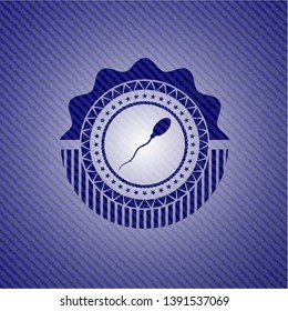 sperm icon inside emblem with jean background