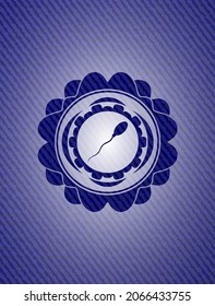 sperm icon inside emblem with jean background. 