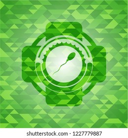 sperm icon inside green emblem with mosaic background