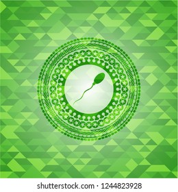 sperm icon inside green emblem with triangle mosaic background