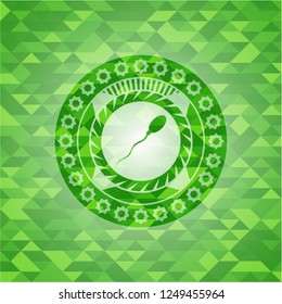 sperm icon inside green emblem with mosaic background