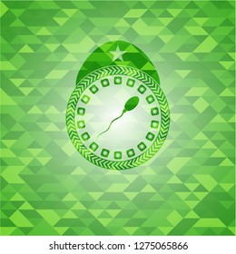 sperm icon inside green emblem. Mosaic background