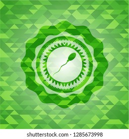 sperm icon inside green emblem. Mosaic background