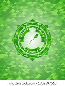 icono de esperma dentro del emblema verde con fondo de mosaico. 