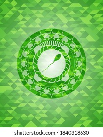 sperm icon inside green emblem with triangle mosaic background. 