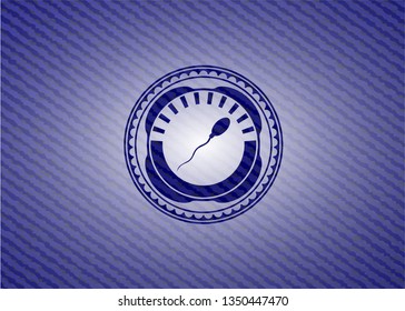 sperm icon inside jean or denim emblem or badge background