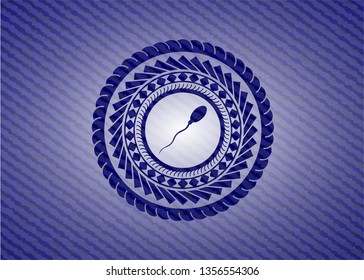 sperm icon inside jean or denim emblem or badge background
