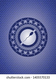 sperm icon inside jean or denim emblem or badge background